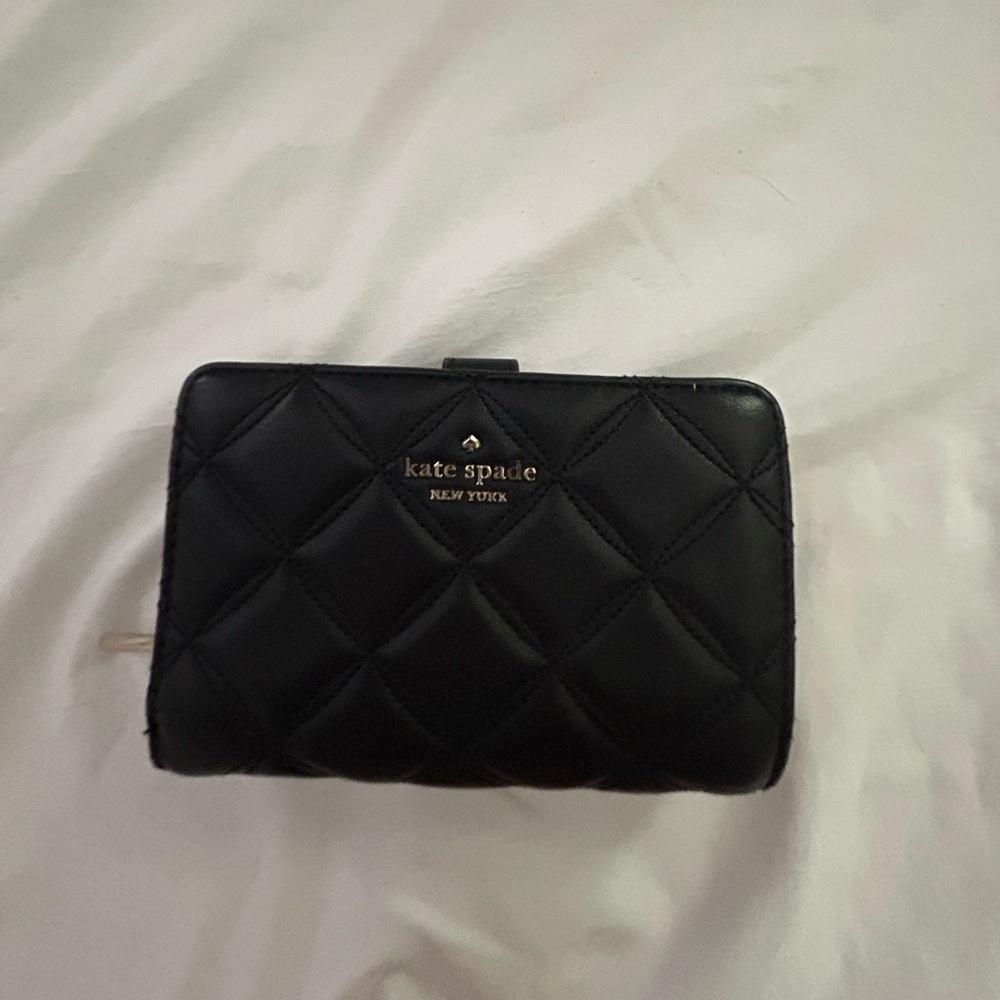 Kate spade wallet good condition but used. Has a card holder and coin pouch.